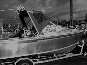 Boat canopy using, Mediterranean blue Sunbrella canvas and Vinistar clear PVC.