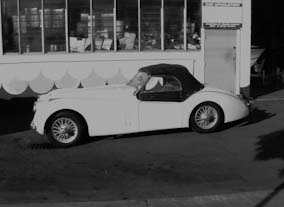 XK120 Jaguar new soft top, using Everflex. Red seats recovered in Connolly leather.