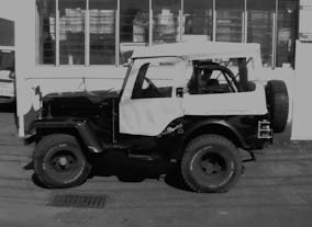 Jeep soft top, using beige acrylic canvas. 